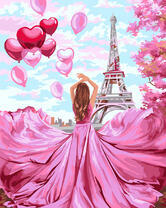 Девушка в розовом платье на фоне Эйфелевой башни